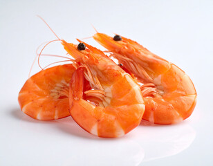 Three Cooked Orange Shrimps on White Background, Seafood Delicacy