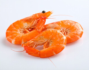 Three Cooked Orange Shrimps on White Background, Seafood