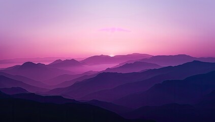 Fototapeta premium Serene sunset over a vast, layered mountain range, bathed in soft purple and pink hues, creating a tranquil and ethereal atmosphere