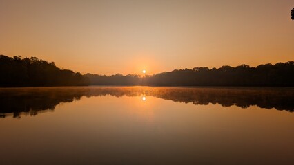 Obraz premium sunset on the river