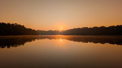 Obraz premium sunset on the river