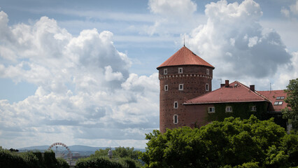 Fototapeta premium Medieval tower of Wawel Castle in Krakow against a cloudy sky