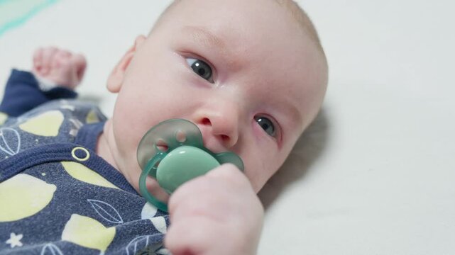 Baby eyes with eye mucus in selective focus. Disease tear ducts tons of newborns close up. Nasolacrimal duct obstruction in baby it is a blockage of the lacrimal drainage system. 