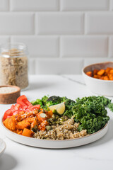 Healthy vegan Buddha bowl with quinoa, pumpkin and seasonal vegetables. Vegetable recipes.