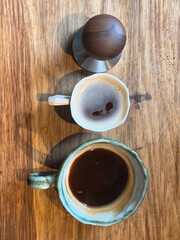 coffee and barista tools on wooden board