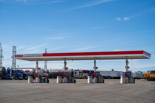 View of Esso commercial cardlock gas station with parked trucks. Toronto, Canada - August 30, 2025.