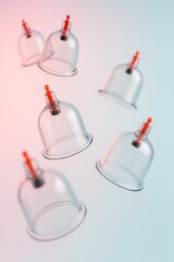 Hijama, treatment according to the Sunnah. Multiple cupping therapy cups hover in motion. Dynamic composition represents alternative medicine and wellness.