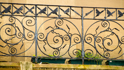 Decorative cast iron balcony railing on a house in San Sebastián, showcasing intricate design and craftsmanship