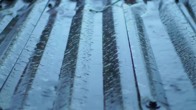 Abstract surface pattern of parallel lines reflecting light