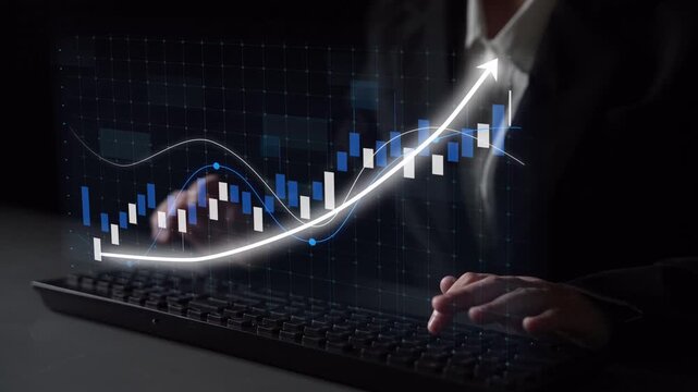 A business professional engages with digital market data using a keyboard, with an upward trending graph displayed. The image reflects modern finance and technology. Copula