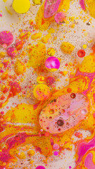 Colorful abstract liquid art background with pink yellow orange bubbles, vibrant psychedelic fluid paint texture, bright modern creative design