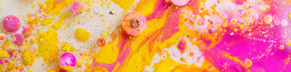 Colorful abstract liquid art background with pink yellow orange bubbles, vibrant psychedelic fluid paint texture, bright modern creative design