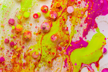 Colorful abstract liquid art background with pink yellow orange bubbles, vibrant psychedelic fluid paint texture, bright modern creative design