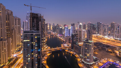 Beautiful aerial top view day to night transition timelapse of Dubai Marina canal