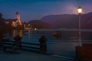 Illuminated lakeside promenade of Saint Wolfgang on Lake Wolfgang by night in the Salzkammergut region, Austria