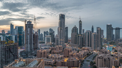 Fototapeta premium Dubai Downtown skyline during sunset timelapse with modern towers panoramic view from the top in Dubai