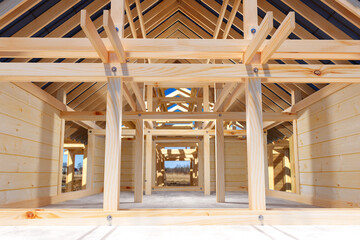 Wooden house under construction. Building frame made of timber. Cottage under construction. Erection building made of timber. Construction of wooden real estate. Erection mansion half-timbered