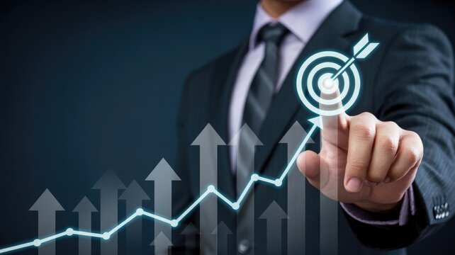 Professional businessman achieving success by targeting growth goals with upward financial charts