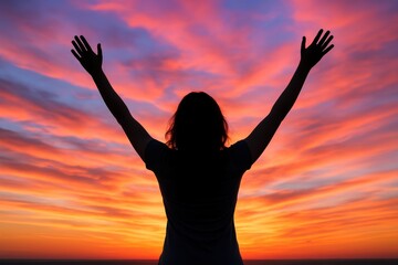 Fototapeta premium Inspiring woman silhouette embracing freedom against spectacular sunset sky with motivational empowerment themes