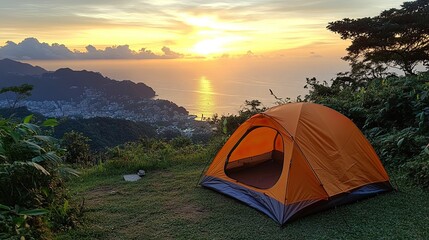 Camping adventure: Tent overlooking a stunning coastal cityscape at sunrise