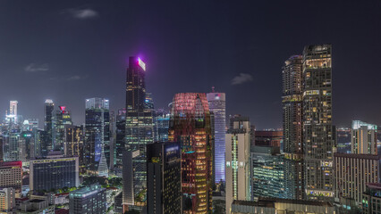 Fototapeta premium Aerial cityscape of Singapore downtown of modern architecture with skyscrapers night timelapse