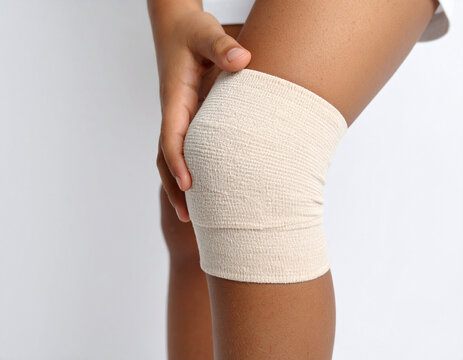 Bandaged Knee Close-Up: Injury Support and Recovery Concept - Powered by Adobe