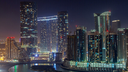Fototapeta premium Buildings on Al Reem island in Abu Dhabi day to night timelapse from above.