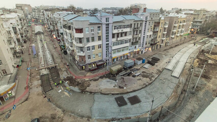 Fototapeta premium Workers with protective mask welding reinforcement for tram tracks in the city timelapse