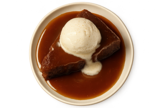 Sticky toffee pudding with ice cream isolated on transparent background view from above.
