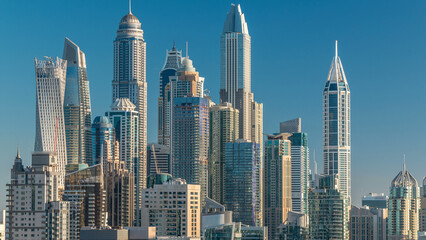 Dubai Marina skyscrapers aerial top view at morning from JLT in Dubai timelapse, UAE.