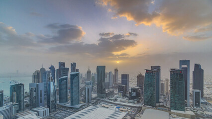 Fototapeta premium Skyscrapers at sunset timelapse in the skyline of commercial center of Doha, the capital Qatar
