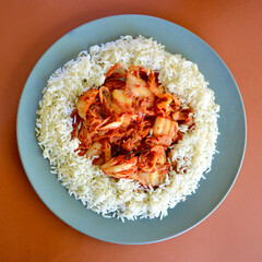 Kim Chi with long grain rice on a plate.
