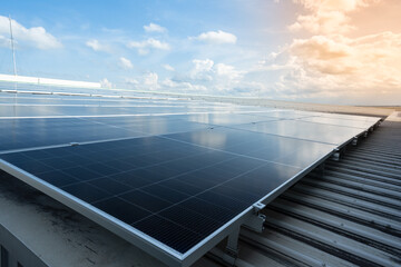Solar panels and blue sky background.Solar cells farm on the roof.Photovoltaic modules for renewable energy.Save the earth and the energy with good environment concept.