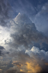 Dramatic storm clouds before a thunder-storm at sunset.