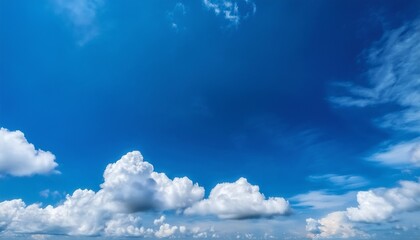 Obraz premium A Bright And Cheerful Sky Filled With Fluffy White Clouds Against A Vibrant Blue Backdrop