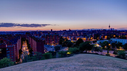 Panoramic day to night timelapse view of Madrid, Spain. Photo taken from the hills of Tio Pio Park,...