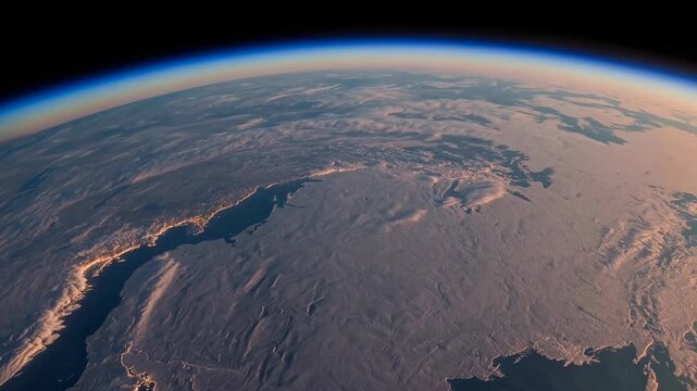 A Breath Taking Aerial View Of Earth's Surface Captured From Space, Showcasing Vast Landmasses And The Curvature Of The Earth Against A Deep Blue Atmosphere