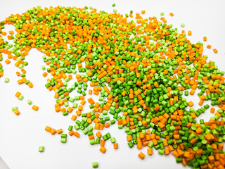 Polymer granules, colorful masterbatch, with a white background can be used for writing space, enlarged photo design as an industrial plastic company profile