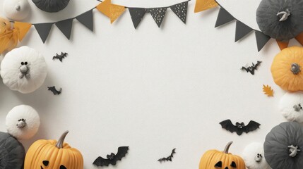Festive halloween decorations with pumpkins and bats arranged around a blank space for text