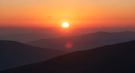Obraz premium Sunrise Over Misty Mountain Range.