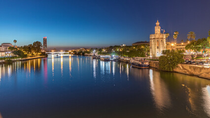 Guadalquivir River near Torre del Oro day to night timelapse in Seville, Spain