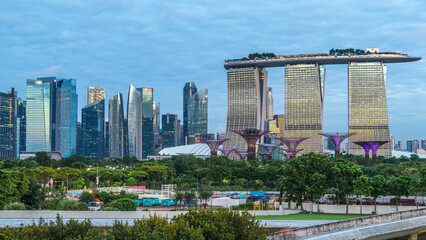 Marina Bay Sands, Gardens by the bay with cloud forest, flower dome and supertrees night to day timelapse before sunrise