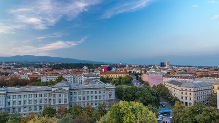 Panorama of the city center day to night timelapse with intersection in front of national theater and museum in Zagreb, Croatia.