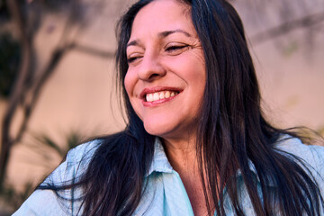 Portrait of a beautiful, smiling, charismatic, and cheerful Latina executive, posing with attitude...