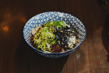 Grilled Korean beef short ribs (galbi) with caramelized edges on hot grill, served with lettuce wraps and kimchi, authentic Korean barbecue dining experience, overhead view.