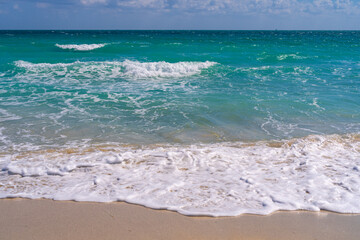 Ocean waves and sand on sky. Stormy sea waves. Summer sea beach wave. Foamy ocean waves. Summer ocean breeze. Dreamy summer beach background. Ocean splash waves.