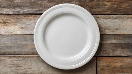 White ceramic plate with smooth rim on aged wooden planks