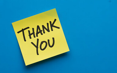 Express sincere appreciation with a handwritten thank you note on a vibrant yellow sticky reminder