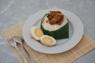 Indonesian Nasi Timbel with Egg on a White Plate