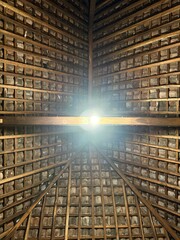 Architectural Ceiling: A view upwards into the architectural brilliance of a meticulously constructed ceiling, showcasing the intricate pattern and structural details from below.